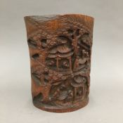 A Chinese carved bamboo brush pot