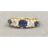 A gold, possibly 18 ct, diamond and sapphire ring (2.