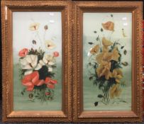 A pair of decorative floral paintings on glass, in gilt frames,