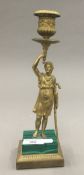 A gilt bronze and malachite figural candlestick