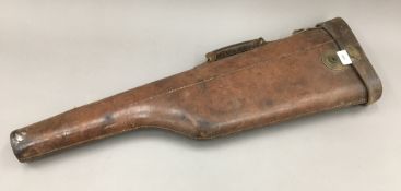 A brass mounted leather leg of mutton gun case