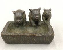 A bronze model of pigs