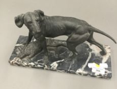 An early 20th century model of a dog with hare