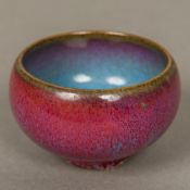 A Chinese Jun ware bowl, with mottled red blue glaze. 5 cm high.