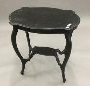 A Victorian ebonised occasional table