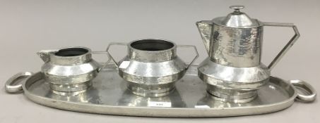 Warwick brand hand hammered pewter three piece Arts and Crafts tea/coffee set together with