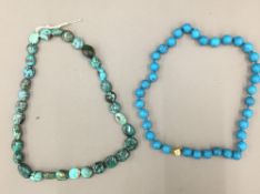 Two strings of turquoise beads