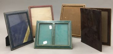 A quantity of leather photograph frames