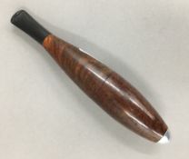 A Zeppelin shaped burr wood cigar holder