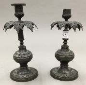 A pair of 19th century bronze candlesticks