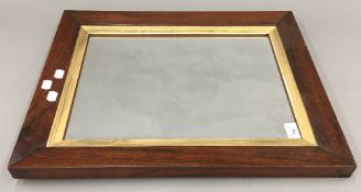 A 19th century rosewood framed wall glass