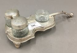 A cruet stand in the form of a violin