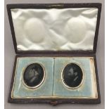 A cased pair of Victorian photographic portrait miniatures