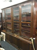 A large Victorian glazed library bookcase cabinet