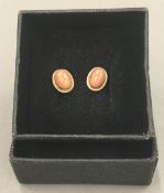 A pair of 9 ct gold coral earrings