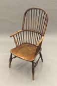 A 19th century elm seated Windsor chair