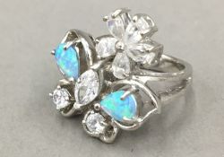 A silver cubic zirconia and opal ring