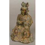 A Chinese cast bronze figure of a court official, modelled seated,