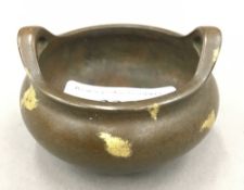 A small gold splash censer