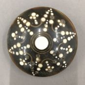 A 19th century circular horn snuff box