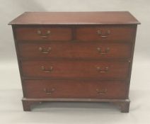 A mahogany two over three chest of drawers