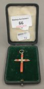 A Victorian yellow metal and coral crucifix