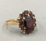 A 9 ct gold garnet ring (2.