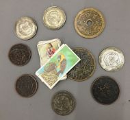 A quantity of Chinese coins and cigarette cards