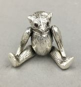 A silver teddy bear