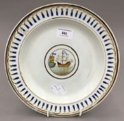 A 19th century Creamware plate centred with a galleon in full sale off a coastal castle,