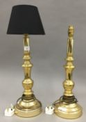 A pair of brass table lamps