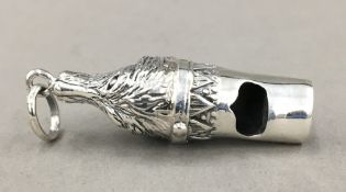 A silver dog whistle
