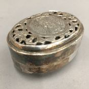 An Indian white metal soap dish and cover