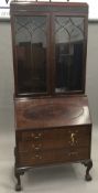 An Edwardian mahogany bureau bookcase