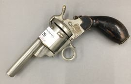 A late 19th century sewing case formed as a revolver pistol