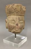 An Antique carved stone head,