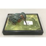 A cold painted bronze model of a kingfisher mounted on an onyx base