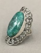 A silver and jade ring
