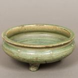 A Chinese porcelain celadon glazed footed bowl With allover crazing. 19 cm diameter.