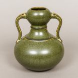 A Chinese porcelain twin handled double gourd vase With allover green glaze,