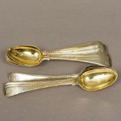 A set of ten George III silver gilt spoons, hallmarked London 1773,