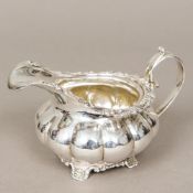 A William IV silver jug, hallmarked London 1830,