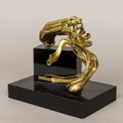 A contemporary modernist brass sculpture Mounted on an ebonised plinth base. 22.5 cm wide.