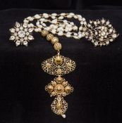 An unmarked yellow metal filigree mounted diamond set pearl necklace Together with two paste set