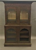 A 19th century Anglo-Indian carved hardwood side cabinet The carved moulded cornice above the