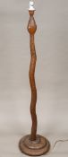 An unusual Indian carved wooden standard lamp Worked as a serpent. 170 cm high overall.