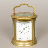 A 19th century French lacquered brass cased striking carriage clock The white enamelled dial with