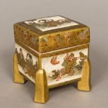 A 19th century Satsuma pottery box and cover Of square section form with gilt block legs,