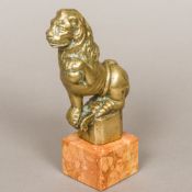 A 19th century or earlier bronze model of a lion,