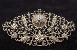 A Georgian unmarked white metal diamond set pendant/brooch Of pierced floral form,